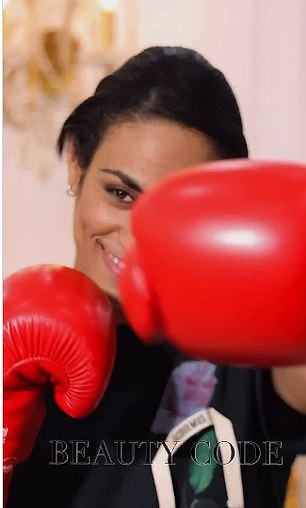 Khelif punches at the camera before a shot of his new transformation