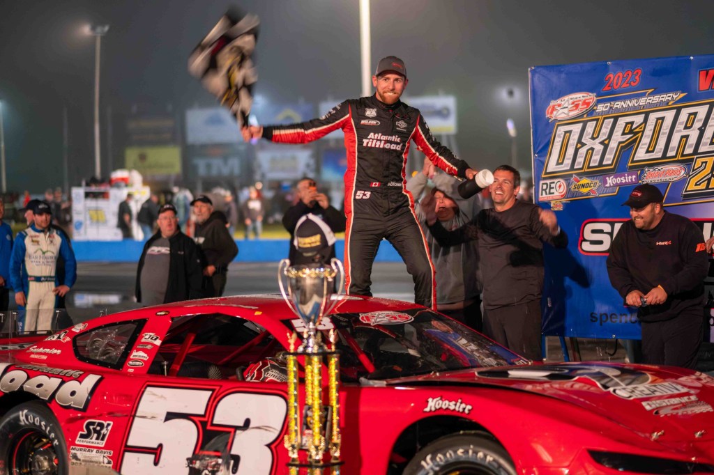 Car racing: The two-time defending Oxford 250 champion was banned from this year's race