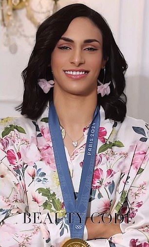 Imane Khelif poses for the cameras while showing off her gold medal from the Paris Olympics